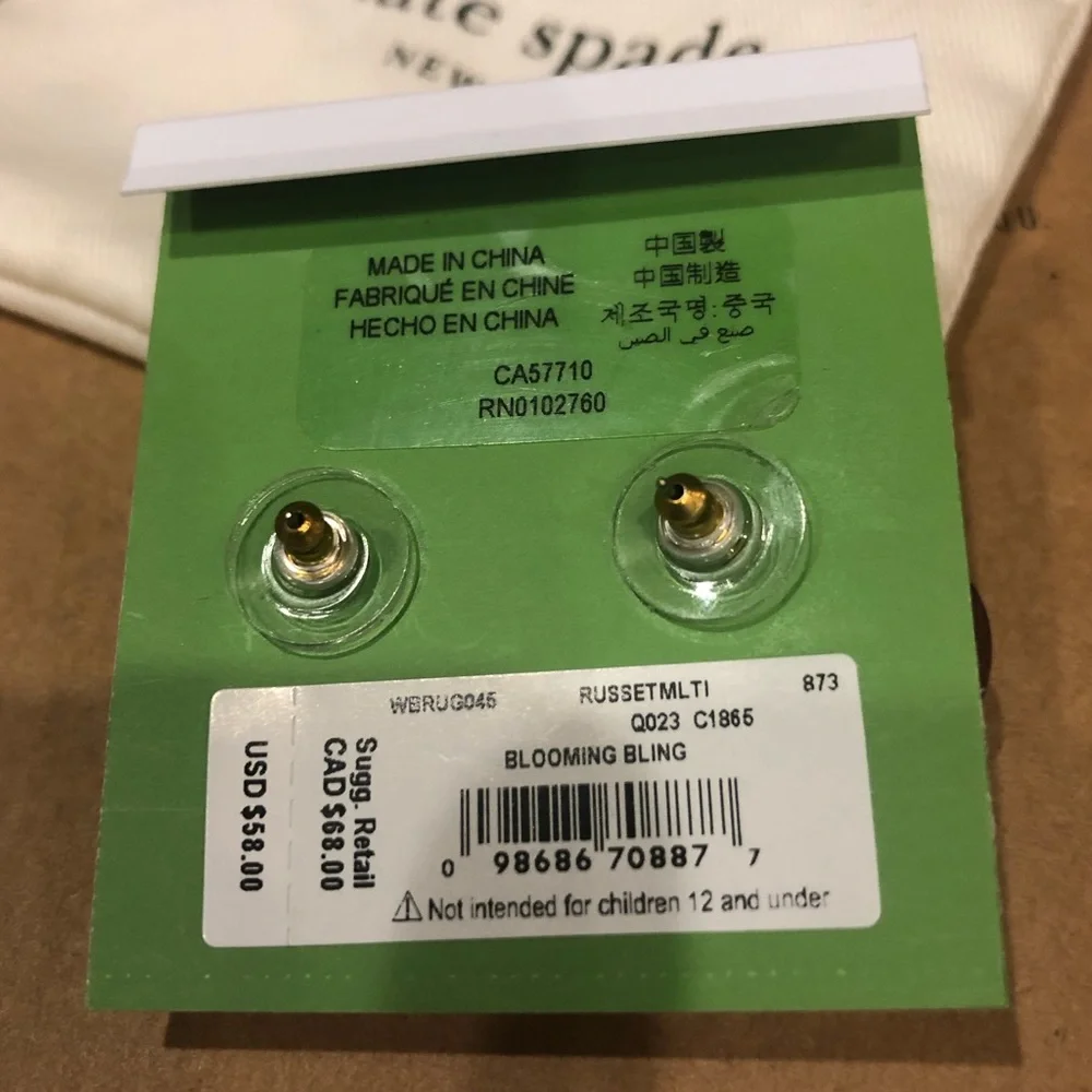 Kate Spade flower earrings. Burgundy leather with pink crystal centers. New!